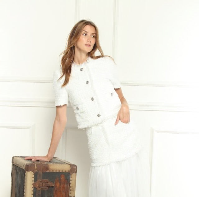 White tweed button jacket from Zero Degrees Celsius Inc, stylish tops with a classic tweed texture and front button closure.