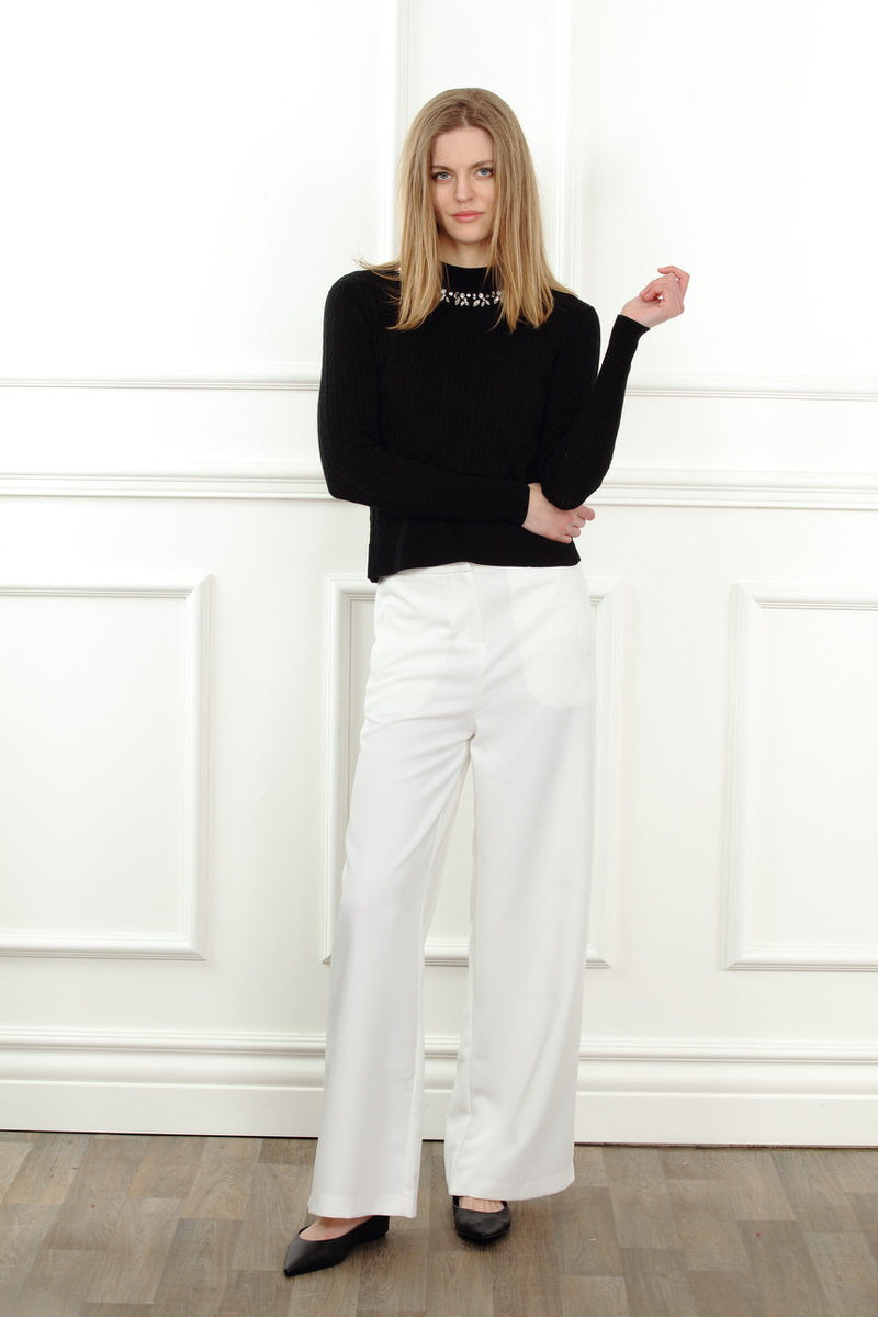 Black crystal necklace sweater top by Zero Degrees Celsius Inc, featuring a stylish knit design with crystal embellishments.