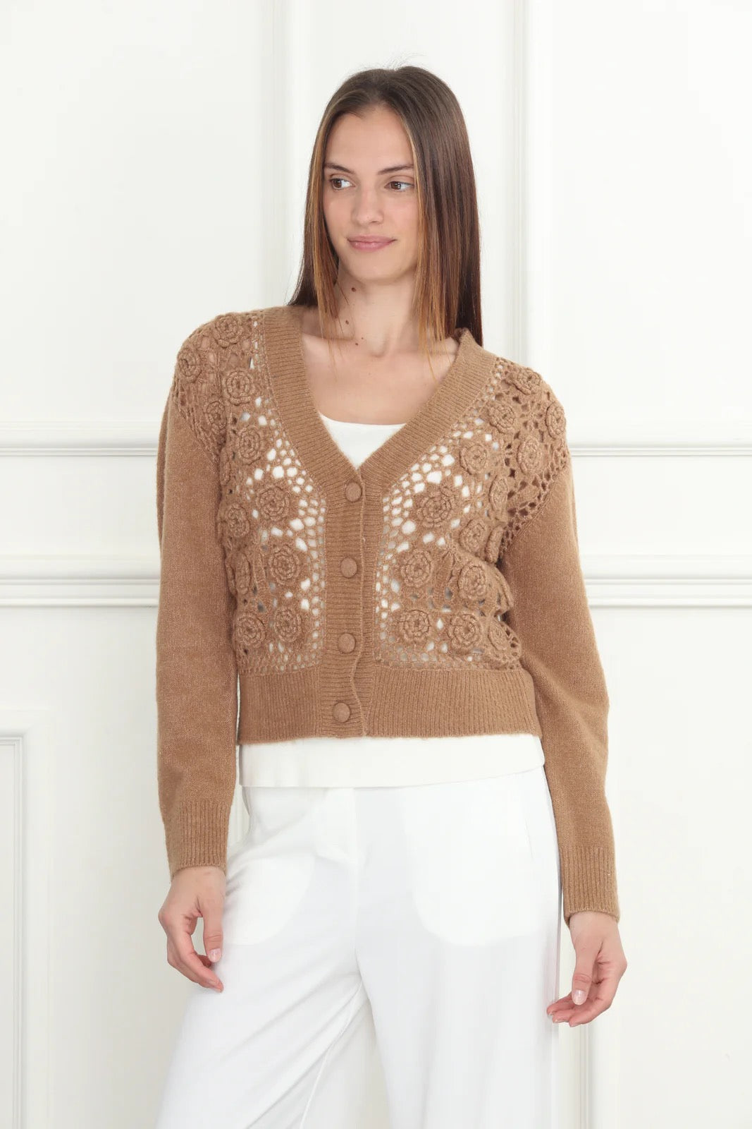 Hand-crochet cardigan from Zero Degrees Celsius Inc, featuring intricate stitching and soft, cozy knit fabric.