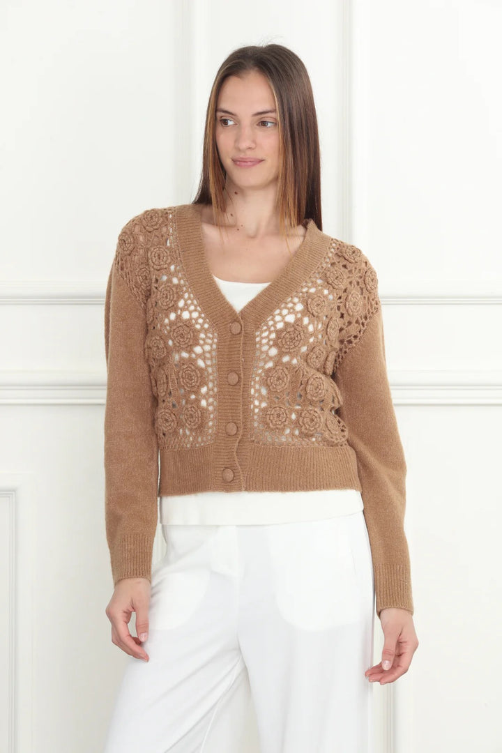 Hand-crochet cardigan from Zero Degrees Celsius Inc, featuring intricate stitching and soft, cozy knit fabric.