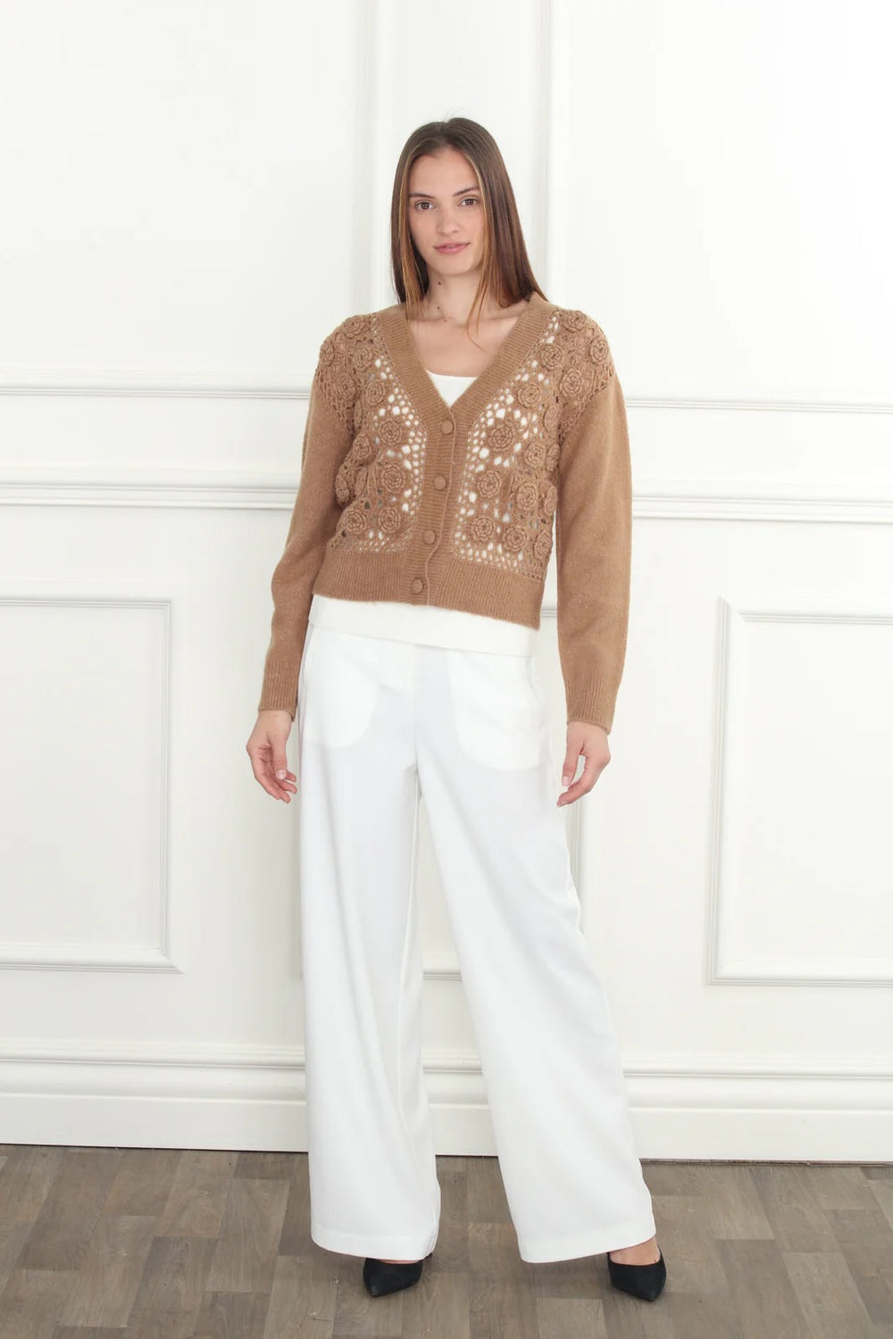 Hand-crochet cardigan by Zero Degrees Celsius Inc, showcasing a cozy, detailed knit top with long sleeves and a relaxed fit.