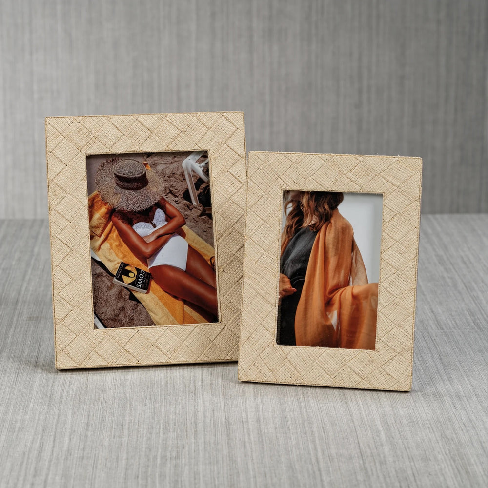 Decorative woven raffia frame by Zodax with natural textured weaving, suitable for home wall decor.