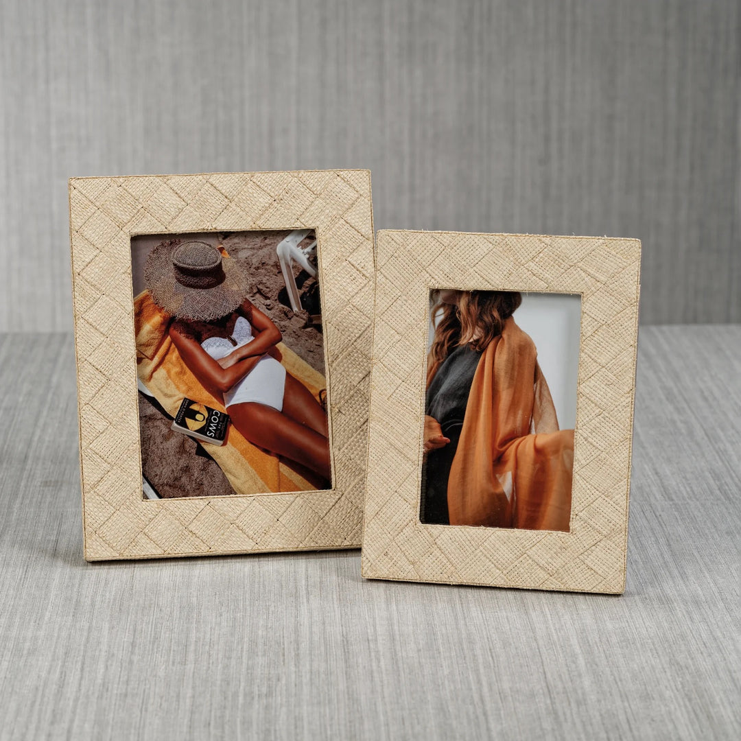 Decorative woven raffia frame by Zodax with natural textured weaving, suitable for home wall decor.