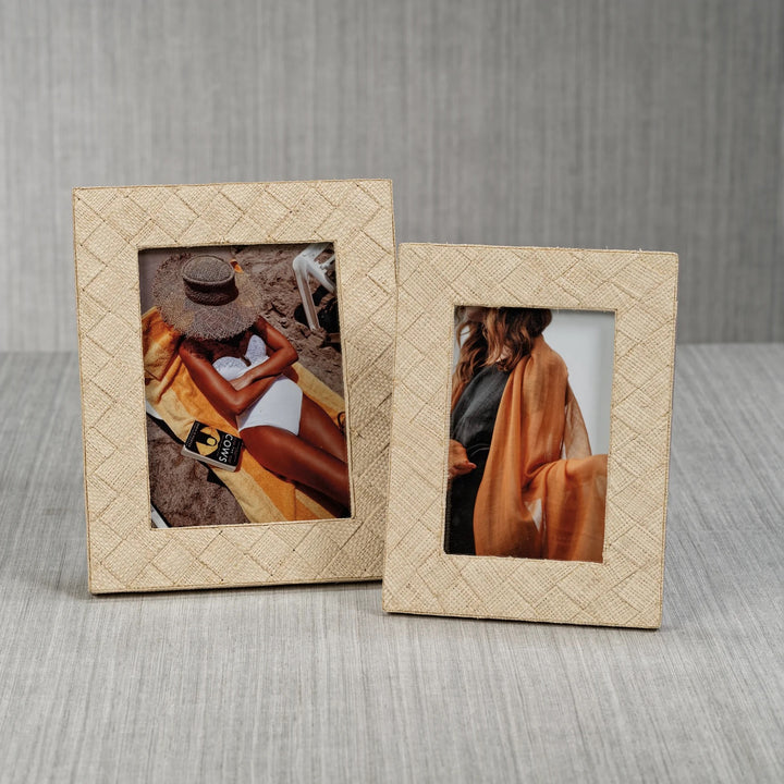 Decorative woven raffia frame by Zodax with natural textured weaving, suitable for home wall decor.