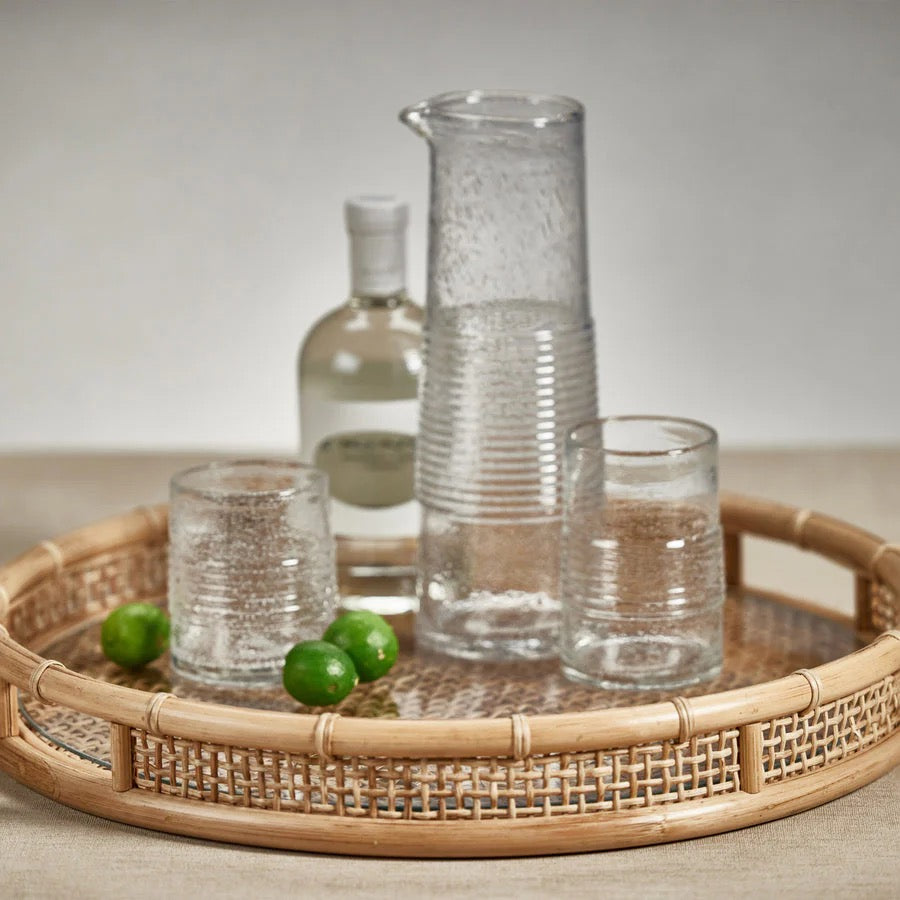 Zodax cane and glass round serving tray with woven handle details, ideal for home entertaining and stylish table presentation.