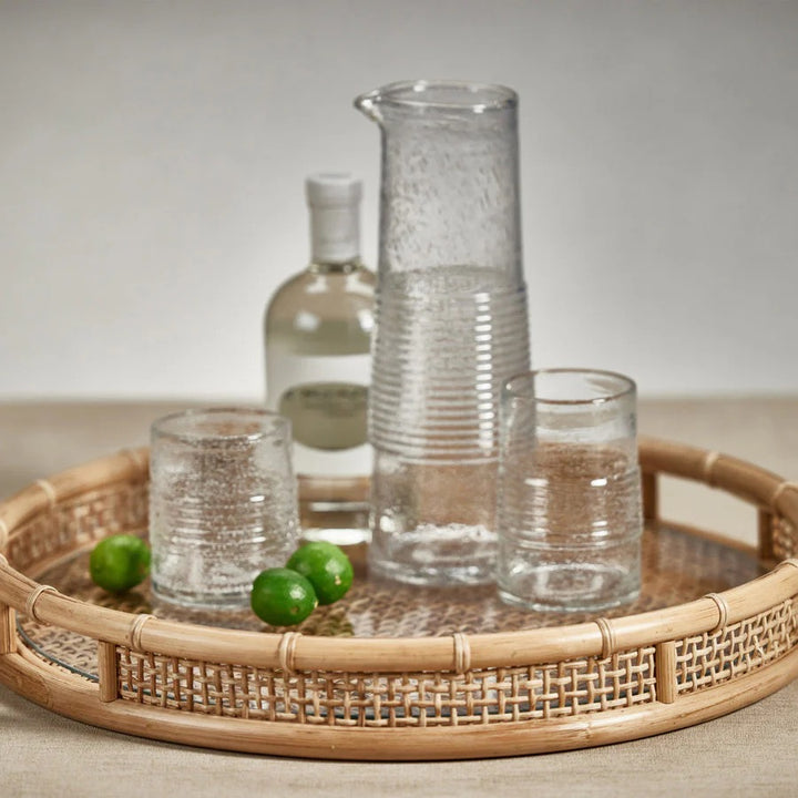 Zodax cane and glass round serving tray with woven handle details, ideal for home entertaining and stylish table presentation.
