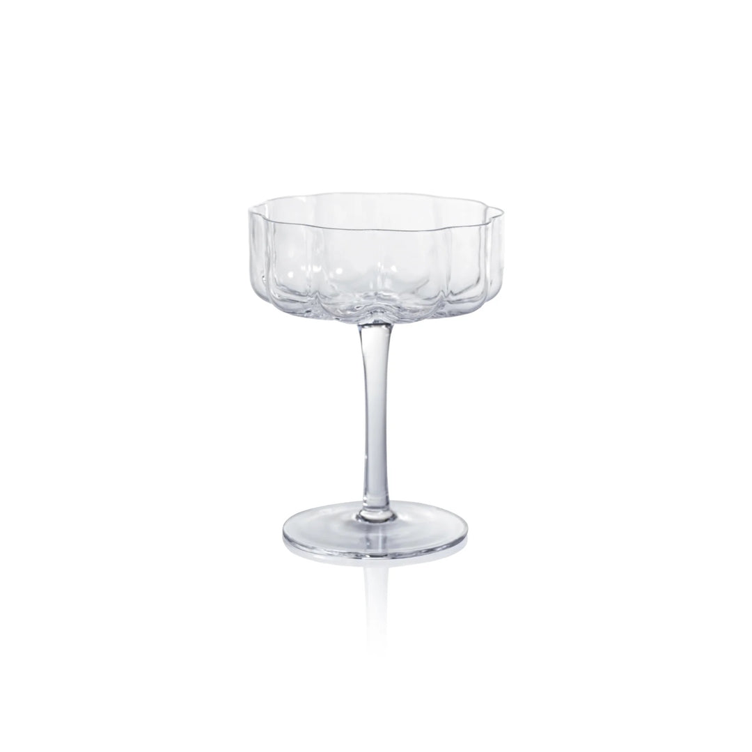 Elegant Zodax handblown coupe glass with a clear, smooth bowl and delicate stem, perfect for serving drinks in a stylish home setting.