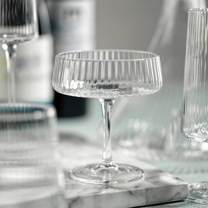 Zodax Lines Fluted Martini Glass with textured, fluted design for elegant home bar use.