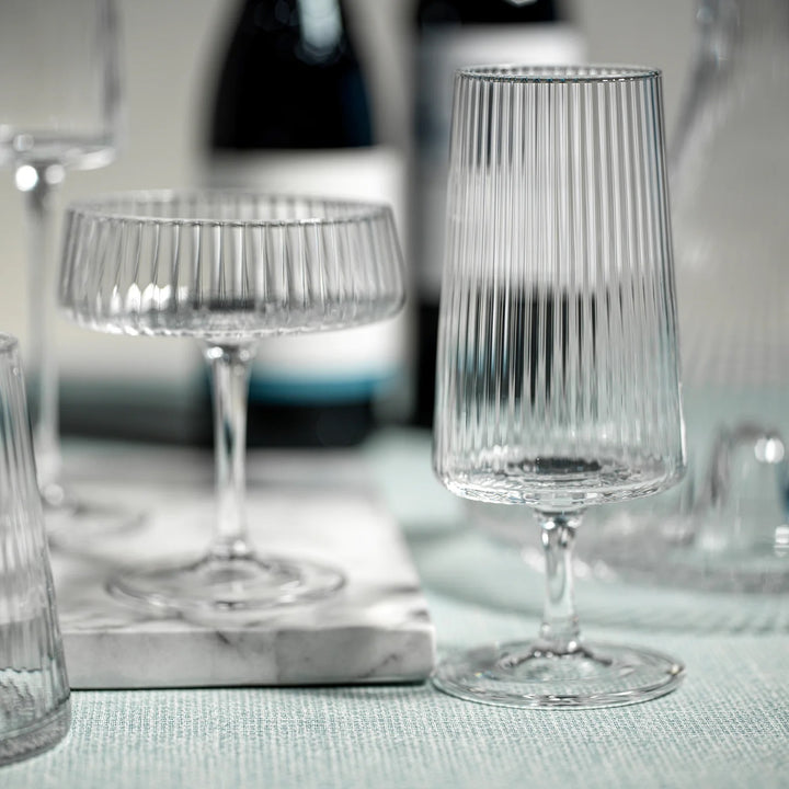 Zodax Lines Fluted Martini Glass with textured, ridged design, elegant stem, clear glass perfect for cocktails and entertaining.