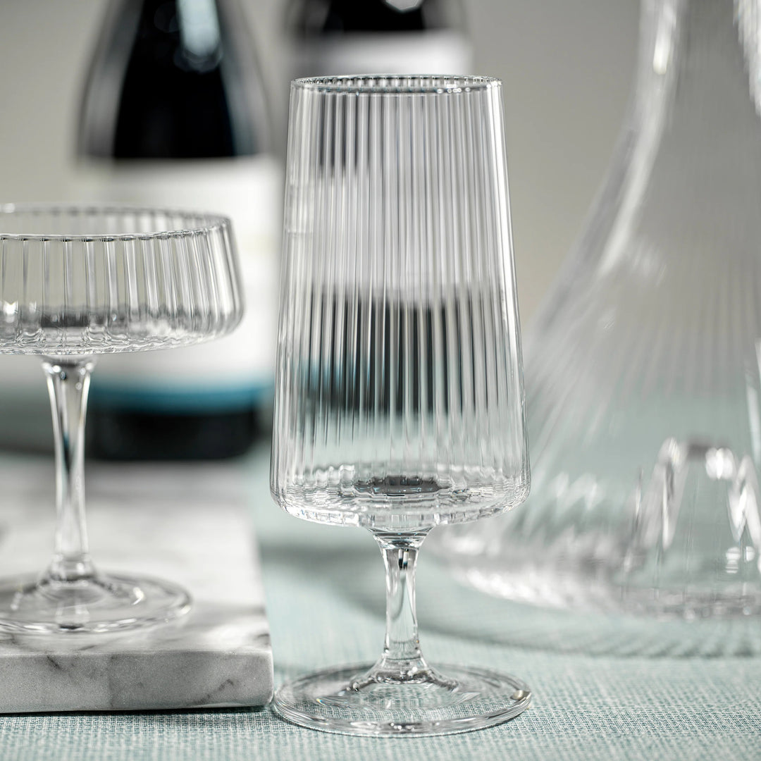 Zodax Lines Fluted Textured Cocktail Glass with elegant ridged design for serving cocktails or beverages.