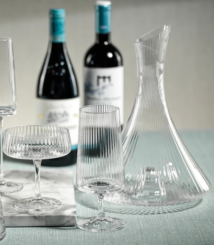 Zodax Lines Fluted Textured Glass Decanter with elegant ridged design for storing and serving beverages.