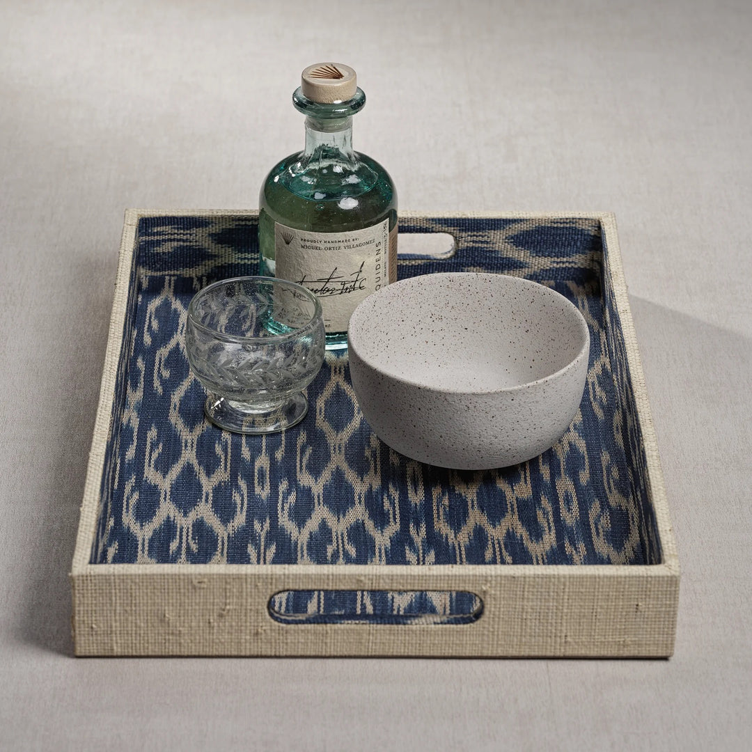 Zodax Raffia and Ikat tray for home decor, featuring woven raffia and vibrant ikat patterns on a stylish tray surface.