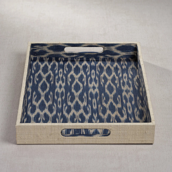 Decorative Zodax Raffia and Ikat tray with intricate woven pattern, ideal for home decor or serving accessories.