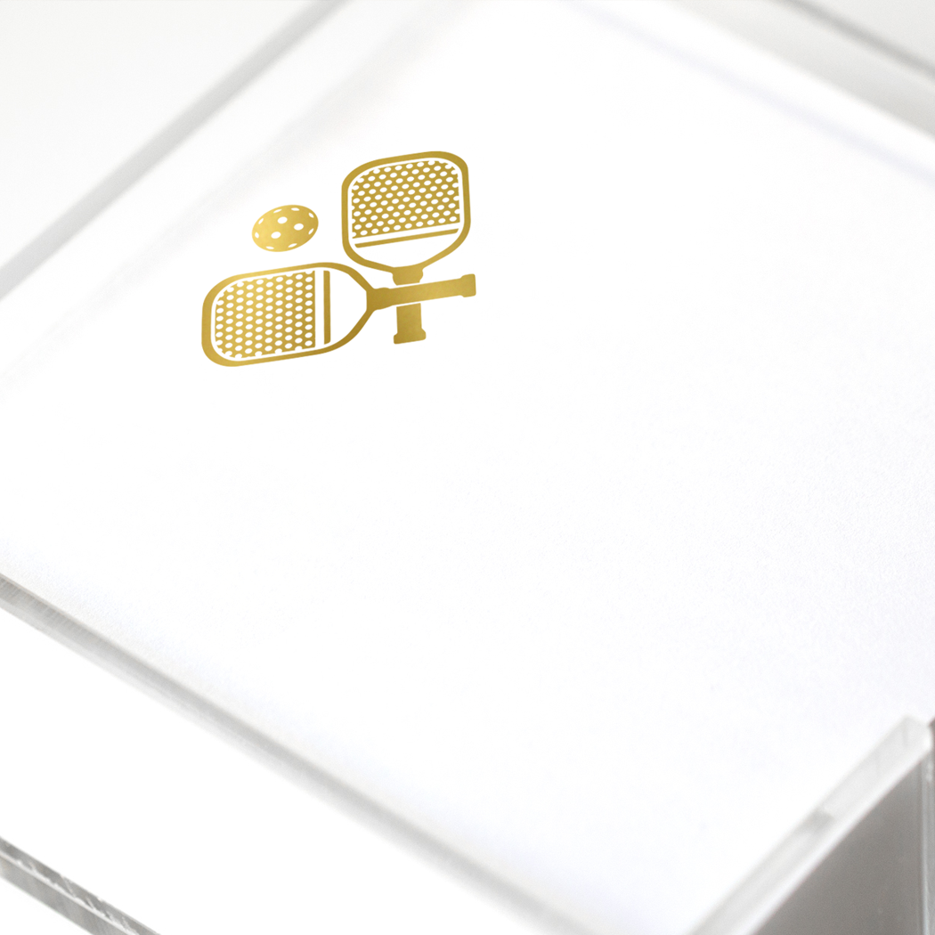Gold foil pickleball notepad from Black Ink, a stylish gift with a pickleball design on the cover.