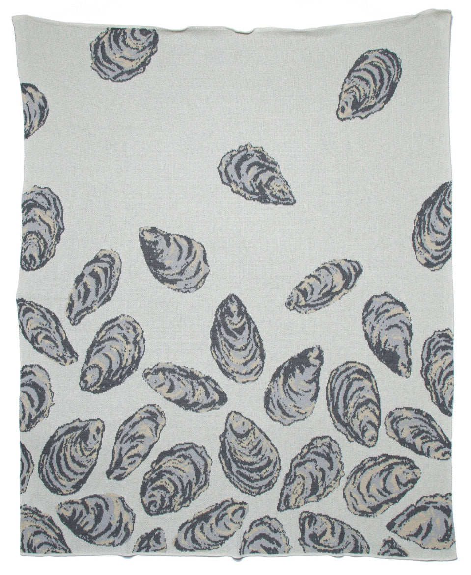 In2Green oyster throw blanket made from recycled cotton, cozy home decor with a textured, natural appearance.