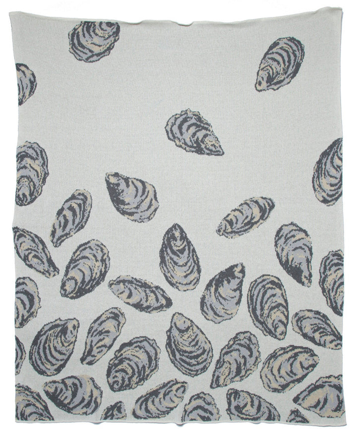 In2Green oyster throw blanket made from recycled cotton, cozy home decor with a textured, natural appearance.
